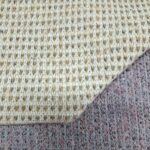 Tessuto maglieria finezza 5 prodotto con filato Italiano Bouclé in blend lana, acrilico, poliestere e cotone
